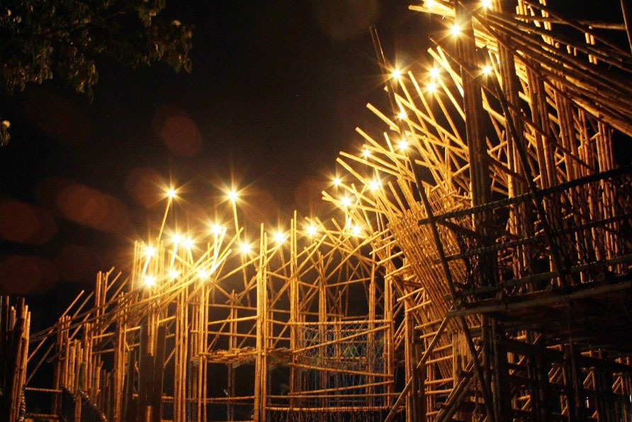 Peace Home's bamboo playground illuminated at night. © LEEDO