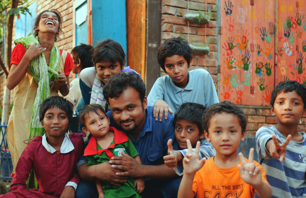 Many children smile at the camera at Peace Home. © LEEDO