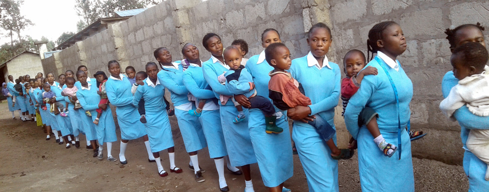 Young mothers line up outside Faraja Center's early childhood development program