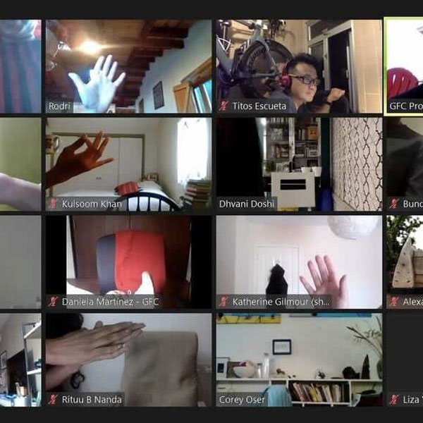 A screenshot of a Zoom meeting during which participants introduced themselves using various limbs and parts.