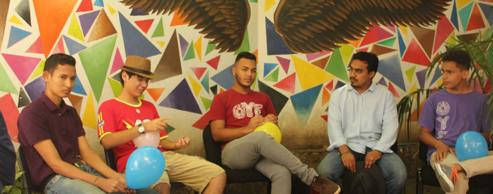 Young men participate in a reflection space in a healthy masculinities circle.