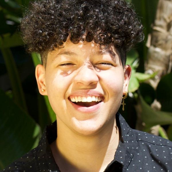 A young person smiling