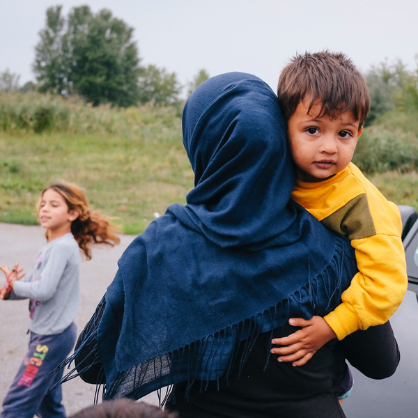 A refugee mother holding a child