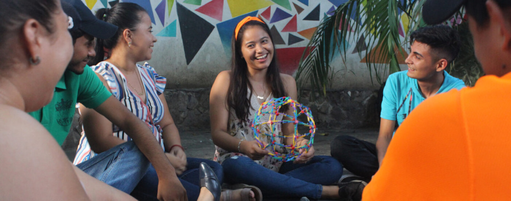 Young people in Honduras sitting in a circle