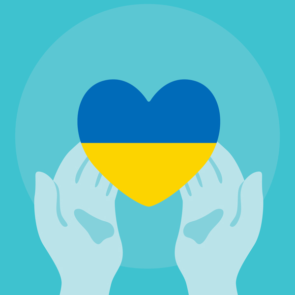 Blue hands holding a heart with the colors of the Ukrainian flag