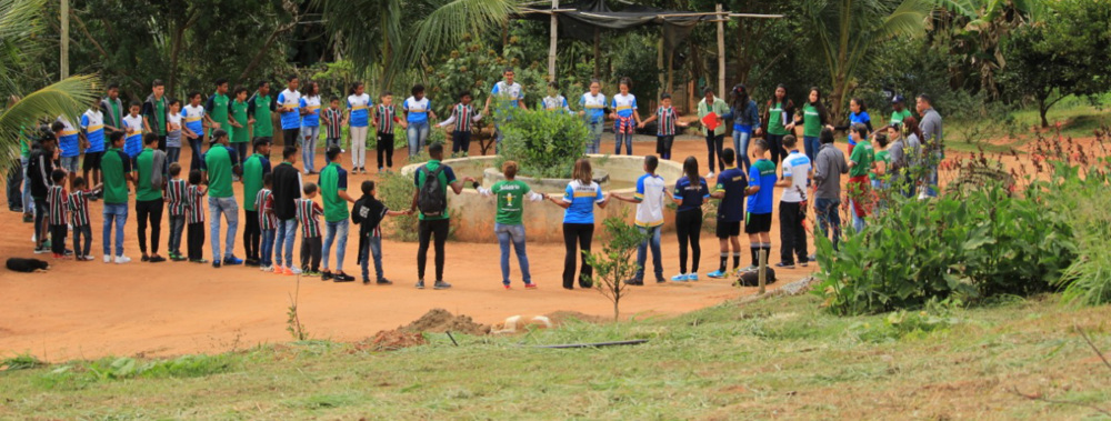 Young people standing in a circle