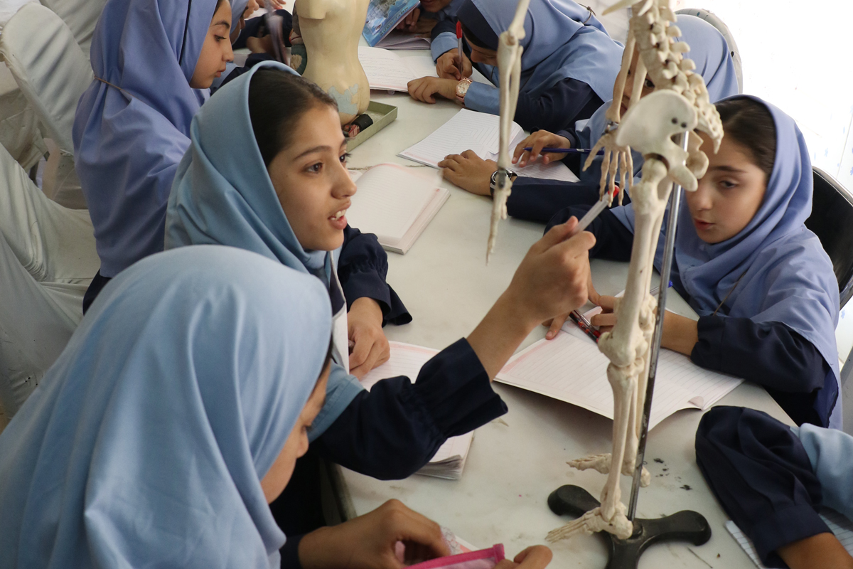 Girls learning about bones in Afghanistan