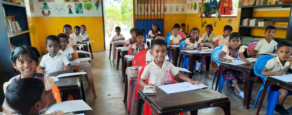 Children sitting at their desks in the Sunshine Preschool in Sri Lanka