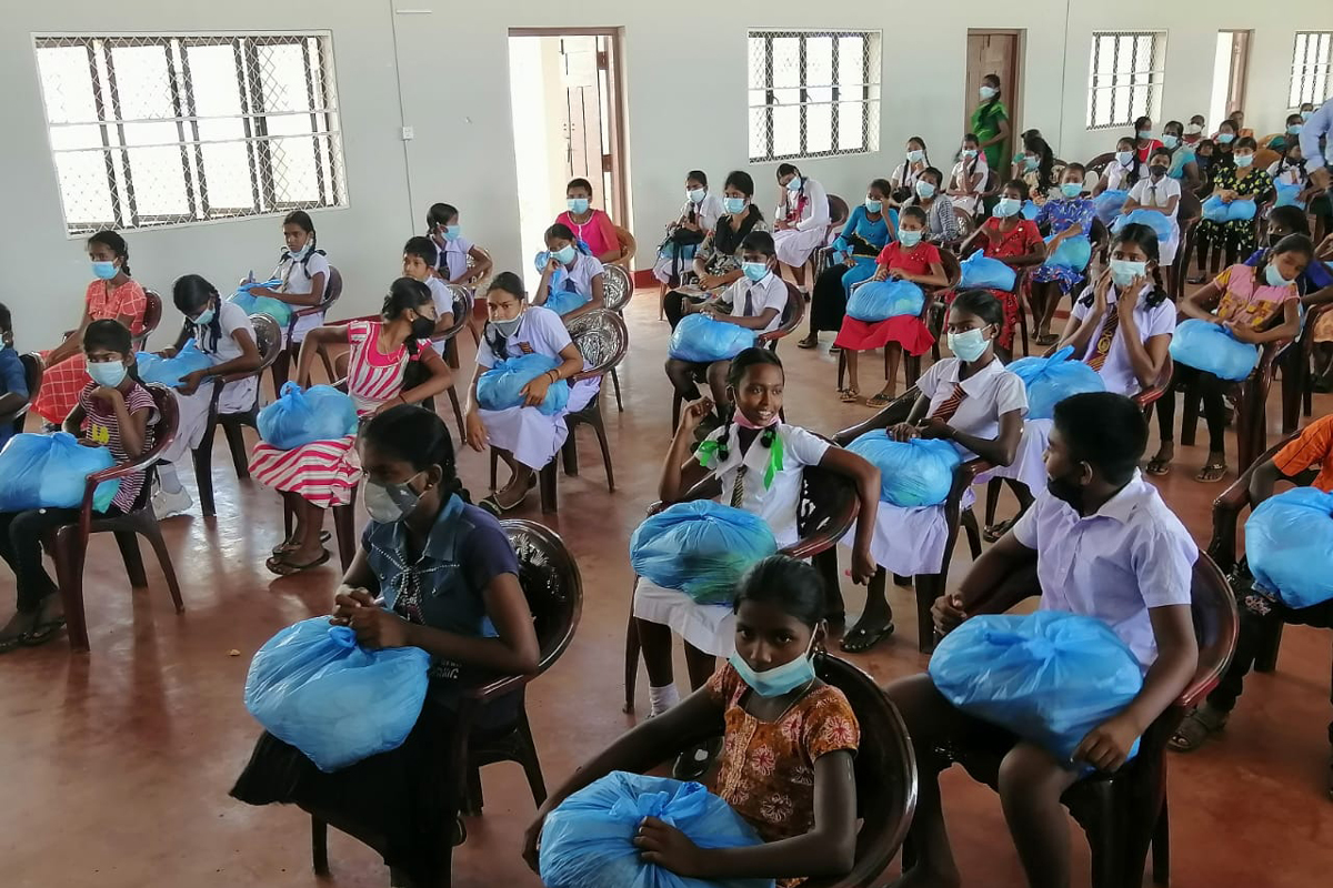 Schoolchildren with bags of food. 