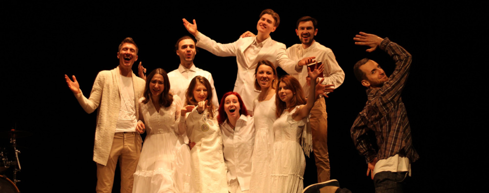 A group of young people at a stage performance.