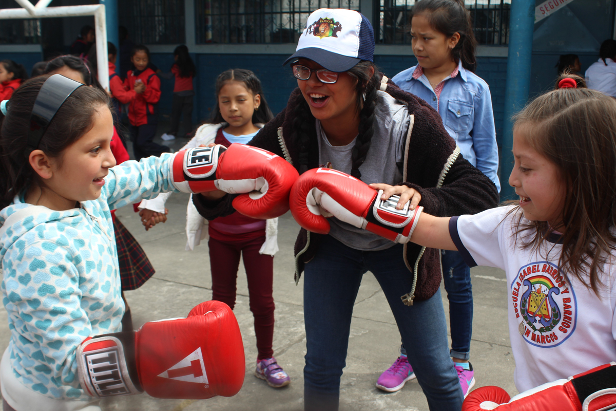Two young girls learning to box