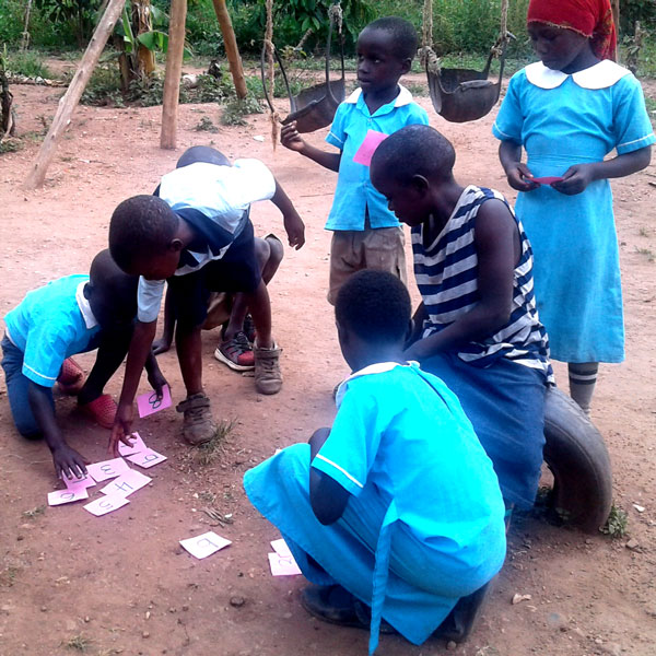 Children in uniforms playing games