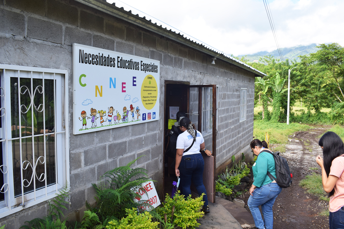 People walking into the Center for Children with Special Educational Needs in Honduras
