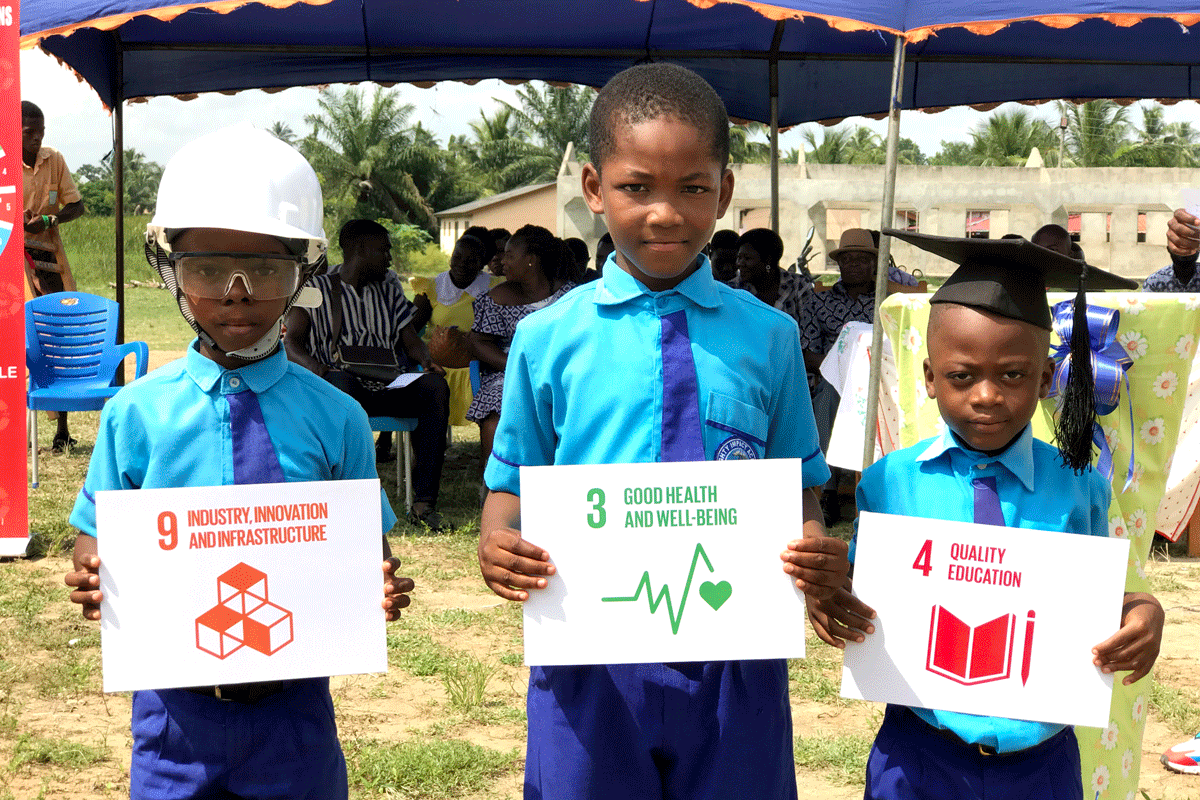 Children carrying placards of SDGs