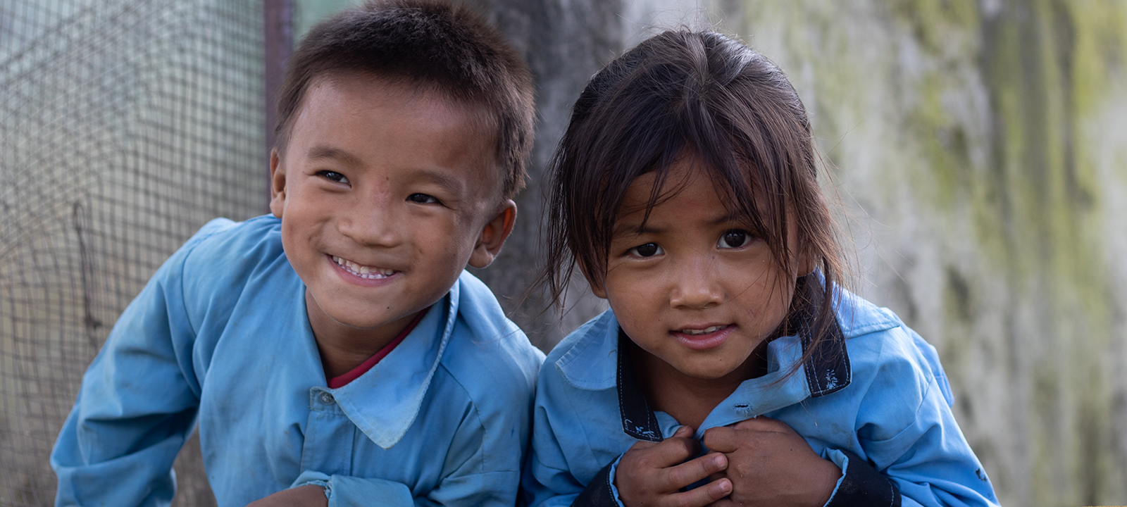 Boy and girl smiling together.