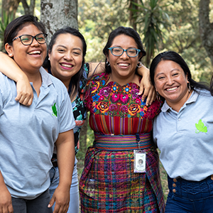 Group of smiling leaders from community-based partner.